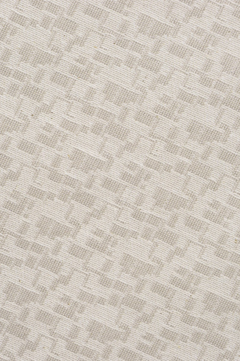 Tejido jacquard beige con tobillos