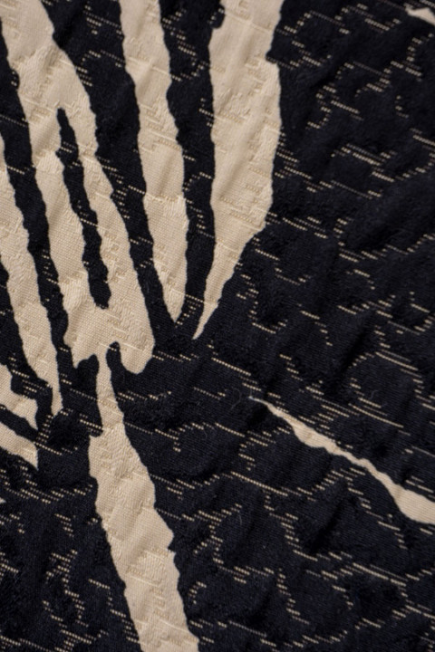 Fabric cremated black leaves on beige