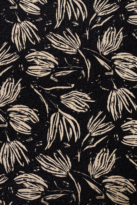 Fabric cremated black leaves on beige