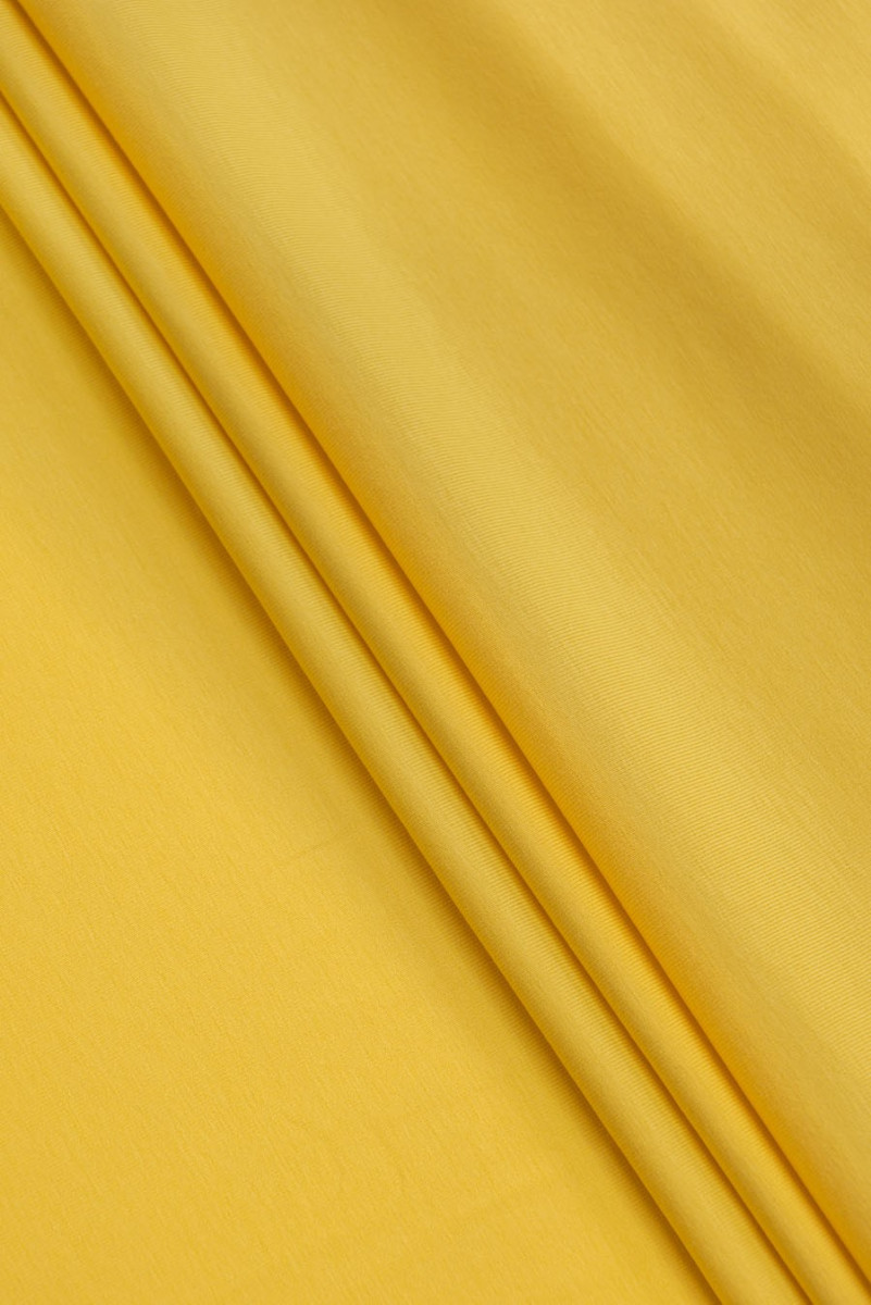 Žlutá bavlněná pletenina