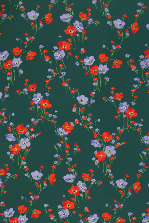 Crepe silk flowers on a green background