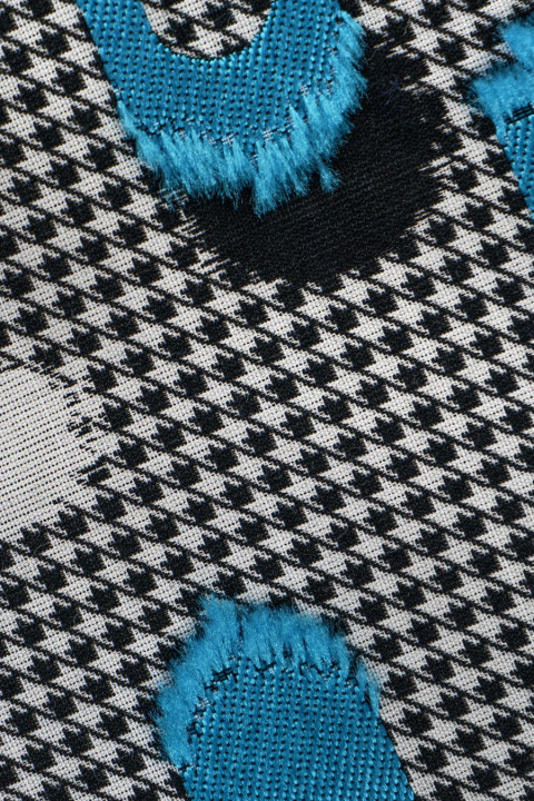 Tejido jacquard - pata de pollo blanca y gris con lunares