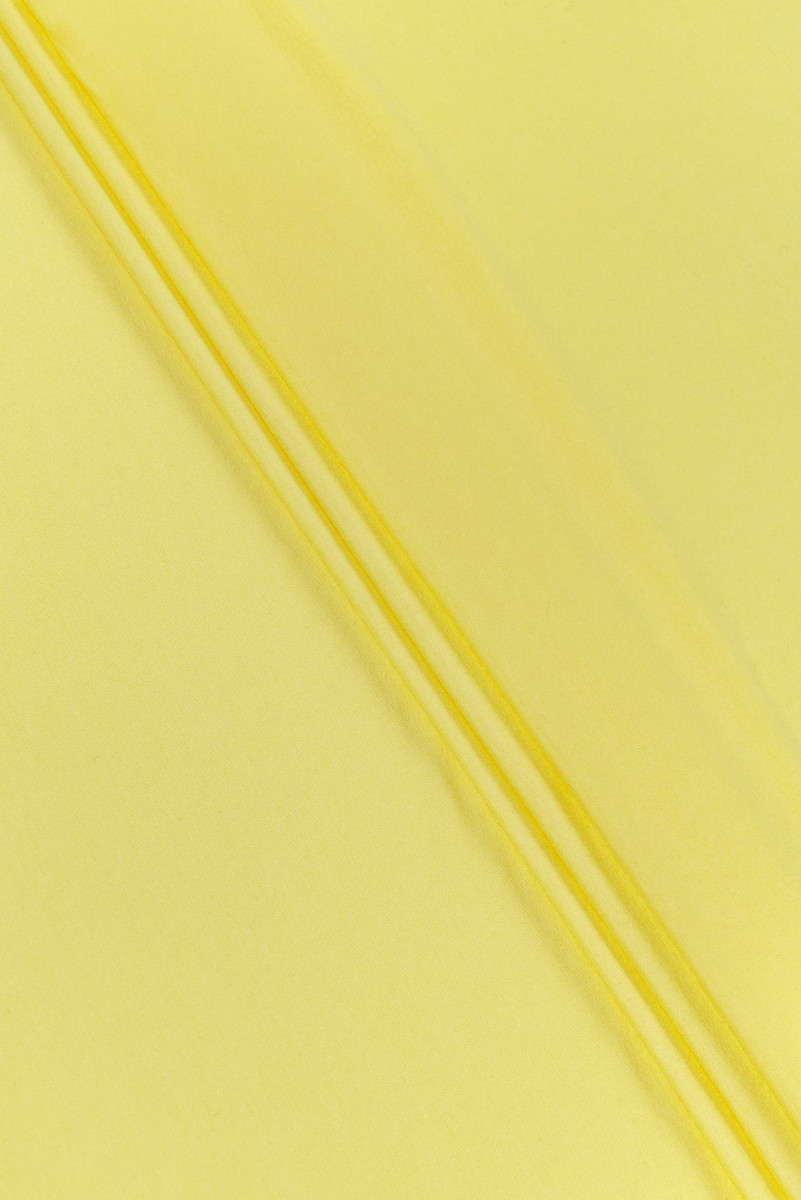 Gele viscose gebreide stof