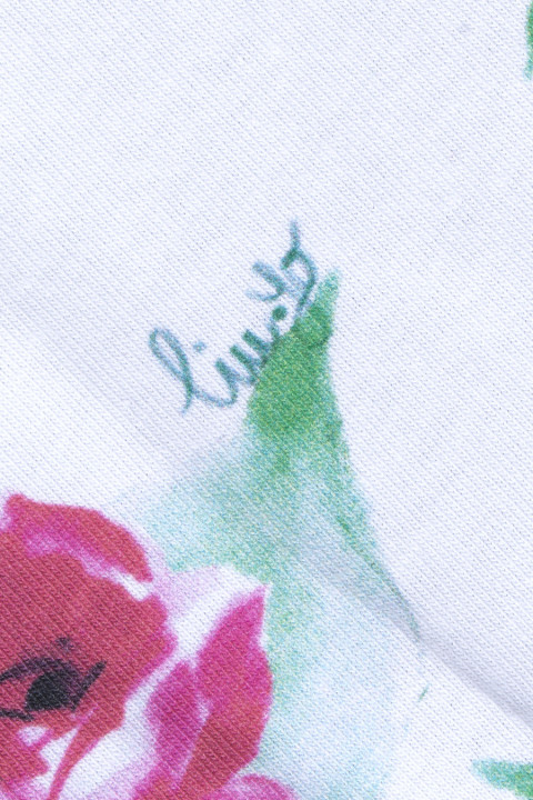 Cotton knitwear signed with roses