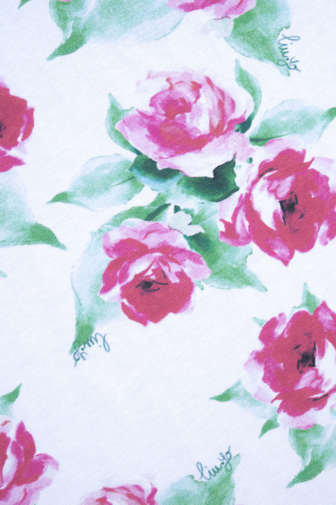 Cotton knitwear signed with roses
