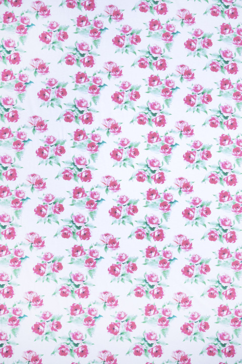 Cotton knitwear signed with roses