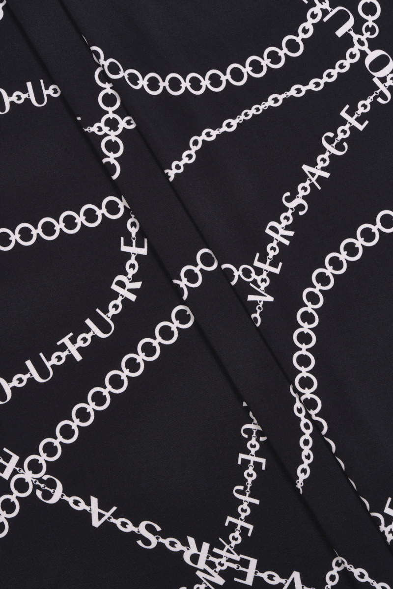 Black knitwear with chains...