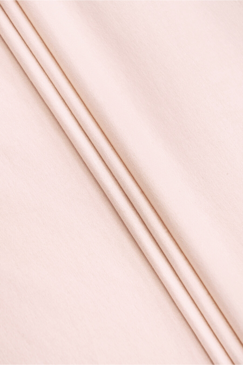 Tissu tricoté rose clair