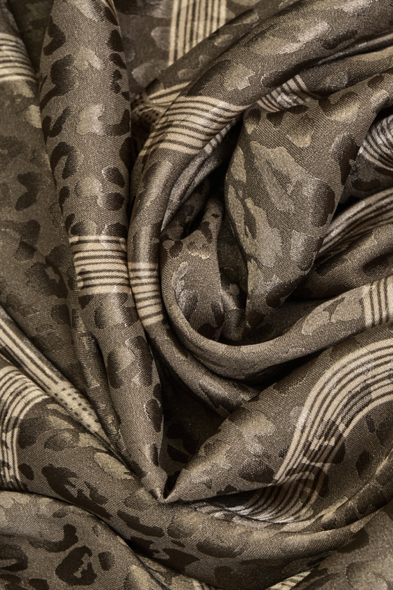 Ribbon and panther jacquard fabric