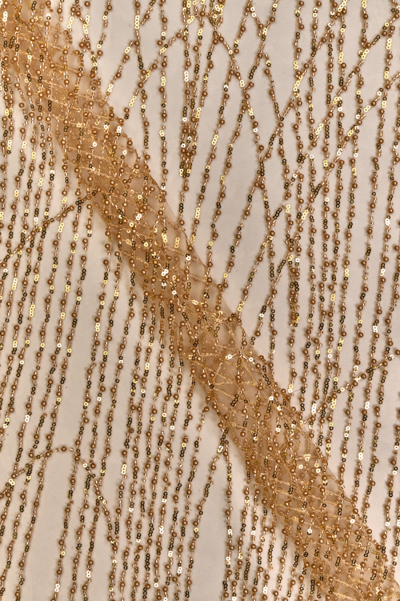 Gold tulle with pearls and sequins