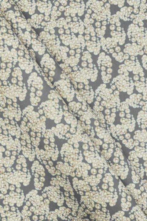 Wool suiting with silk pearl motif on a gray background